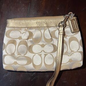 Vintage Coach Gold Wristlet wallet.